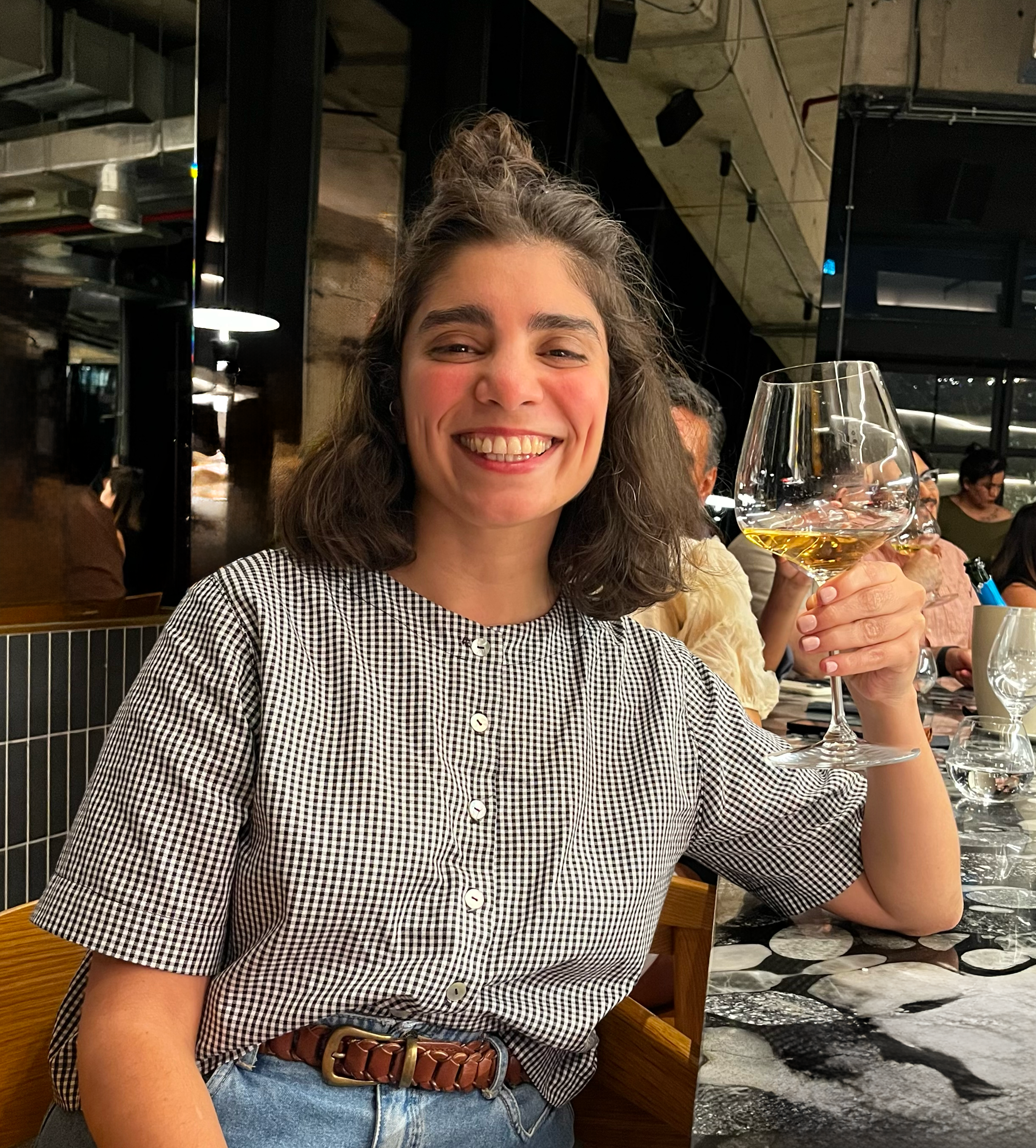 Javiera Barrientos holding glass wine